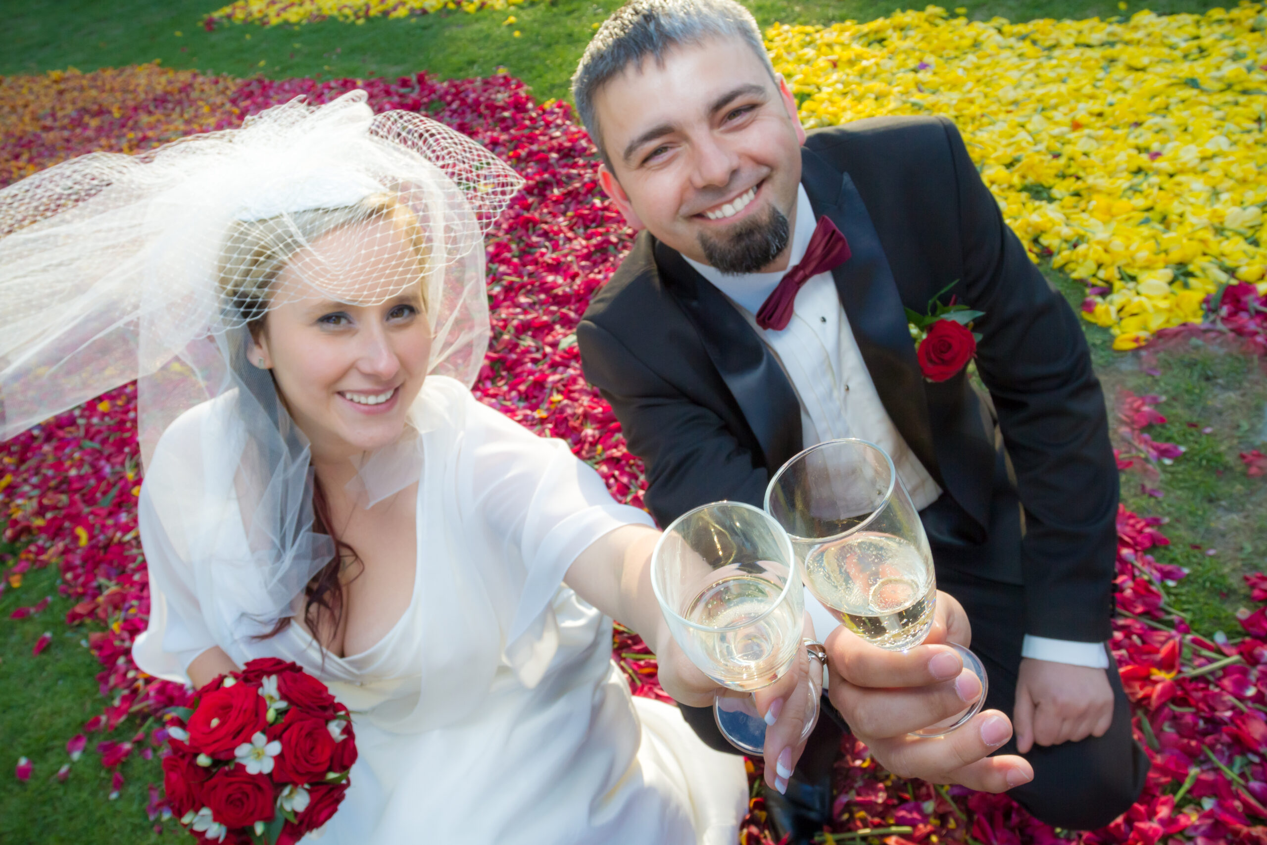 Bride and groom makes a toast with champagne