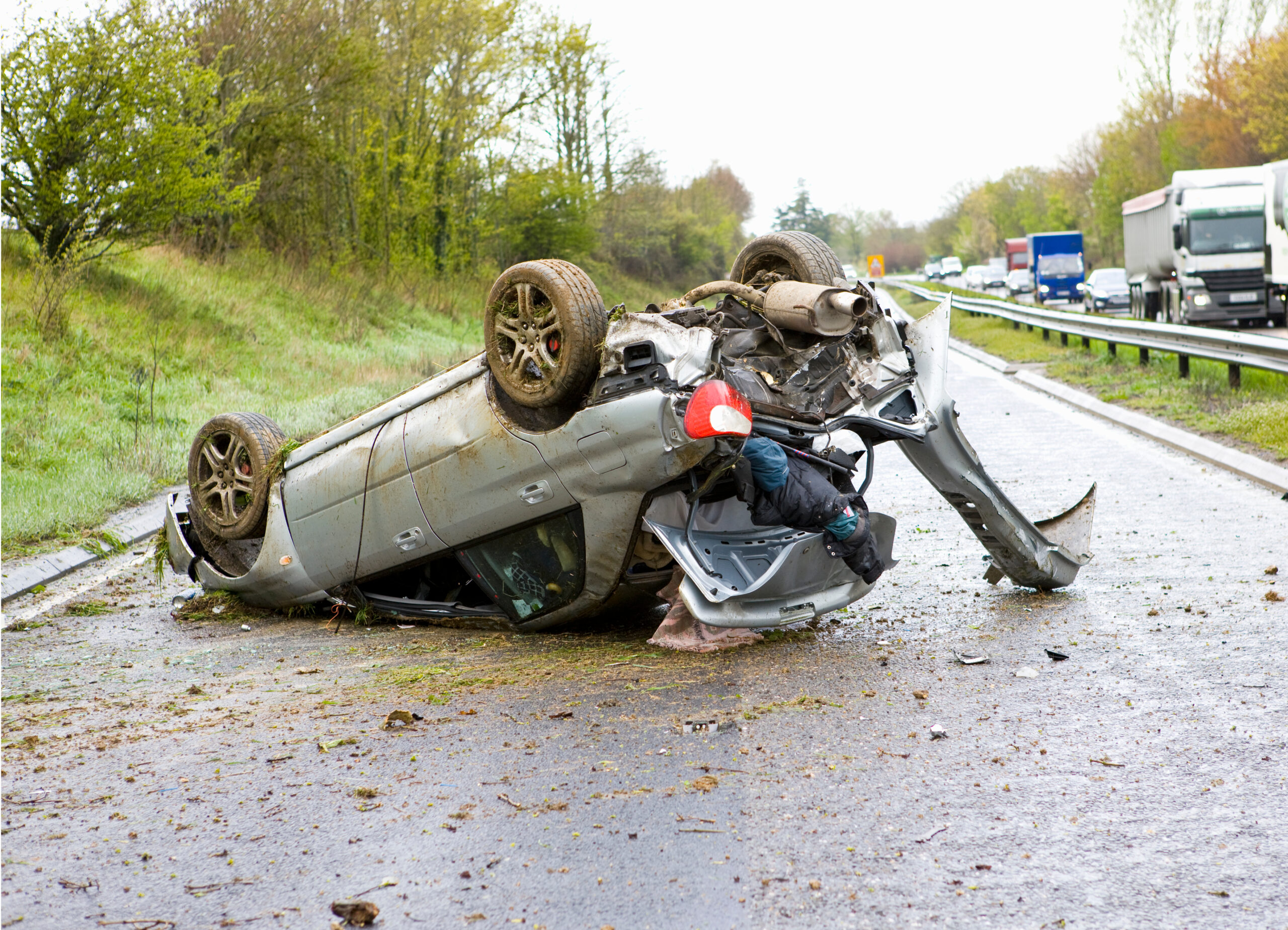 car-after-a-crash-lying-upside-down-on-a-motorway-2025-10-16-22-17-08-utc