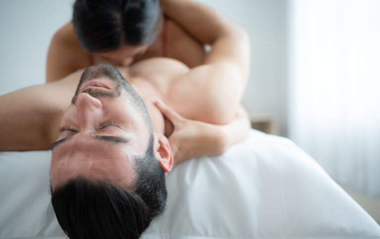 Gorgeous sexy couple enjoying arousing sex before having sex on bed in home bedroom The concept of emotional and love relationships.